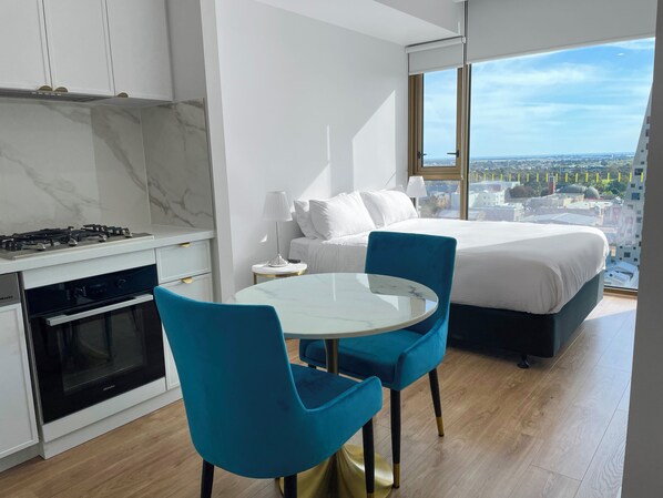 24-inch flat-screen TV with cable channels - The Cullinan Apartments by CLLIX (Adelaide)