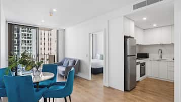 One Bedroom Apartment | Living area | 24-inch flat-screen TV with cable channels