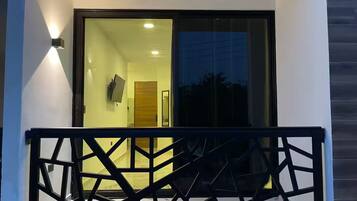 Quarto triplo luxo, vista para a cidade | Sacada