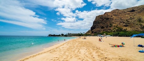 Sun loungers, beach umbrellas, beach towels