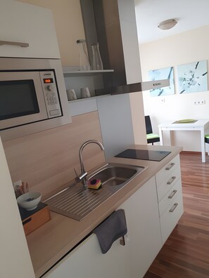 Fridge, microwave, stovetop, coffee/tea maker