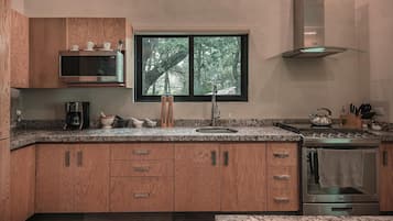 Microwave, oven, coffee/tea maker, dining tables