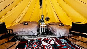 A tent with two beds, a small table, and a fan. - Hotel O Jerai Nature Glamping (Yan)
