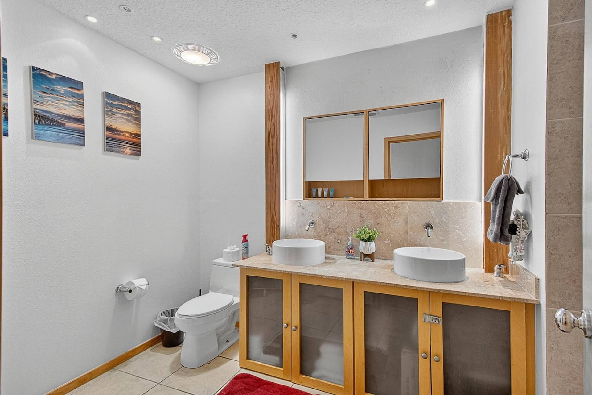 Relax and refresh in this inviting bathroom with dual sinks and large counter space.