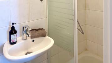 Shower, towels, soap, shampoo