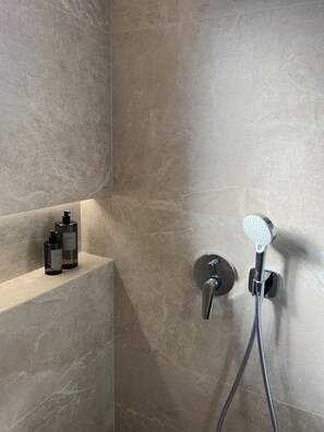 Shower, hair dryer, towels, soap