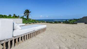 On the beach, sun loungers, beach towels