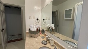 Shower, hair dryer, towels, soap