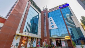 A modern hotel with a prominent sign for "Tab Hotels" and "Airport View". - Fabhotel Prime Airport View (Jaipur)