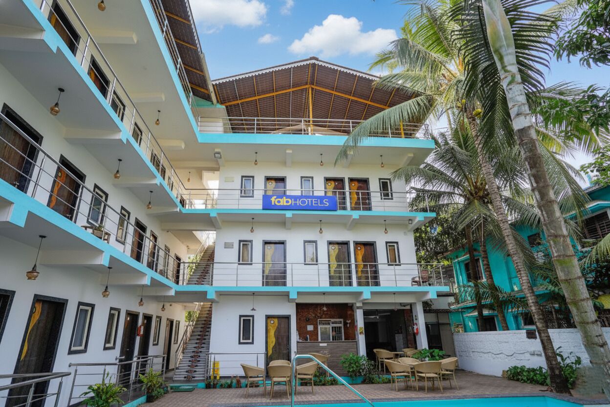A multi-story building with a sign reading "fabHOTELS".