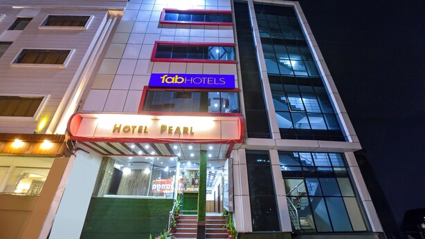 A multi-story hotel building with a prominent 'fab hotels' sign and a 'Hotel Pearl' sign at the entrance. - Fabhotel Pearl (Haridwar)