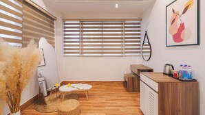 A modern, well-lit room with wooden flooring, a small round table with a book, a radiator, a radiator cover, a wooden bench, a radiator, a radiator cover, a radiator, a radiator cover, a radiator, a radiator cover, a radiator, a radiator cover, a radiator, a radiator cover, a radiator, a radiator cover, a radiator, a radiator cover, a radiator, a radiator cover, a radiator, a radiator cover, a radiator, a radiator cover, a radiator, a radiator cover, a radiator, a radiator cover, a radiator, a radiator cover, a radiator, a radiator cover, a radiator, a radiator cover, a radiator, a radiator cover, a radiator, a radiator cover, a radiator, a radiator cover, a radiator, a radiator cover, a radiator, a radiator cover, a radiator, a radiator cover, a radiator, a radiator cover, a radiator, a radiator cover, a radiator, a radiator cover, - The Morris Central Hotel - O'TEL (Xuan Huong - Da Lat)