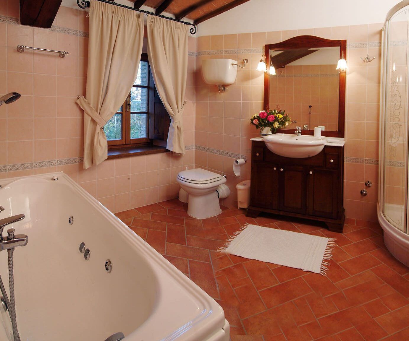 A bathroom with a bathtub, toilet, sink, and shower.