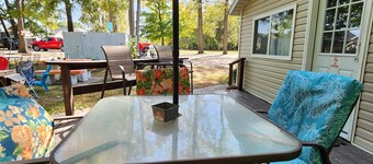 One Bedroom Cabin - Lakeview - Charming 500 sq ft one-bedroom cabin located at Outrigger Resort, just 1/4 mile from Indiana Beach Amustment Park! Features a lake view, private bathroom, kitchen, and living room. One (1) queen bed and one (1) futon al