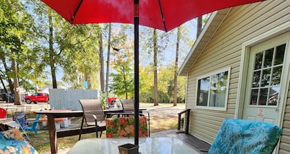 One Bedroom Cabin - Lakeview - Charming 500 sq ft one-bedroom cabin located at Outrigger Resort, just 1/4 mile from Indiana Beach Amustment Park! Features a lake view, private bathroom, kitchen, and living room. One (1) queen bed and one (1) futon al