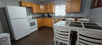 Two Bedroom Cabin - "The Big One" - This spacious cabin gets it's name honestly! Cabin is 800 sq ft with two-bedrooms feature three (3) queen beds, one (1) full size bed, and two (2) futons allow for a max of twelve (12) people. Conveniently located