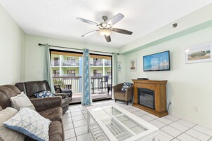 Signature Condo, 2 Bedrooms, Non Smoking, Kitchen | Living room | 50-inch Smart TV with cable channels