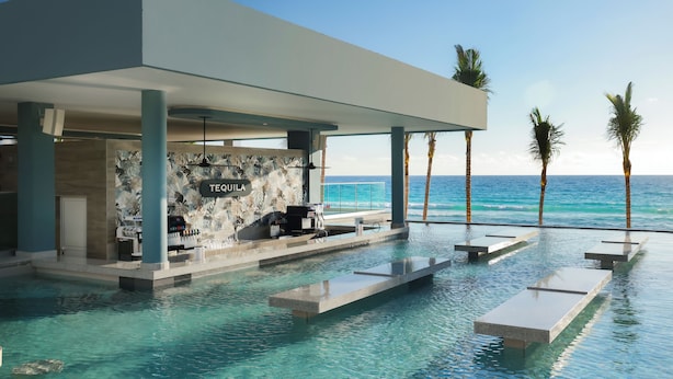 Un área de piscina moderna con un bar llamado "TEQUILA", con vistas al océano.