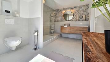 Shower, hair dryer, towels, toilet paper