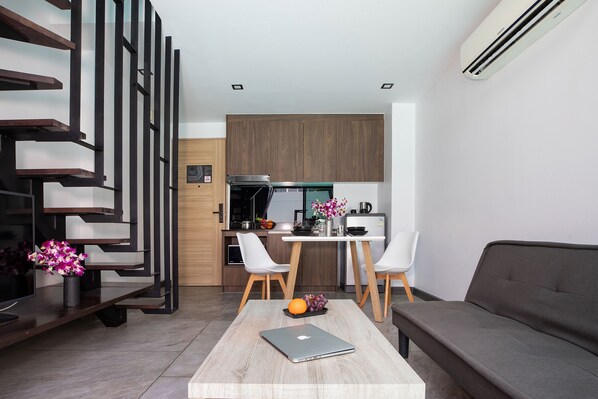 Exclusive Apartment, Balcony, Pool View | Living room | Flat-screen TV