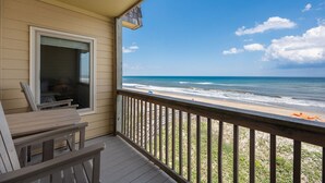 A wooden deck with a view of the beach and ocean. - GSH2 Ocean-Front Condo, Ocean Views, Comm.Pool (Kill Devil Hills)