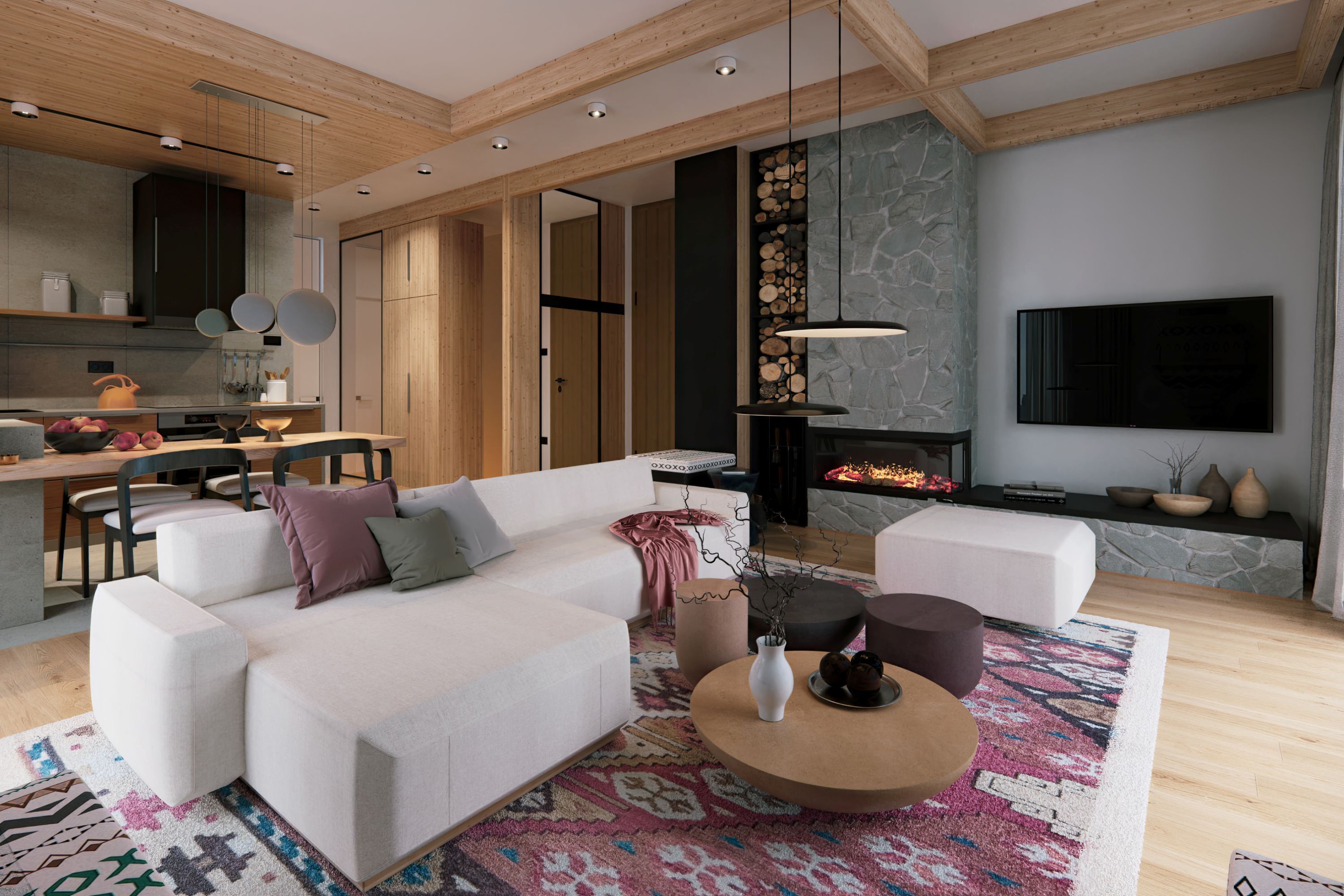 A modern living room with a white sofa, a coffee table, and a fireplace. There is a television mounted on the wall and a kitchen area visible in the background.