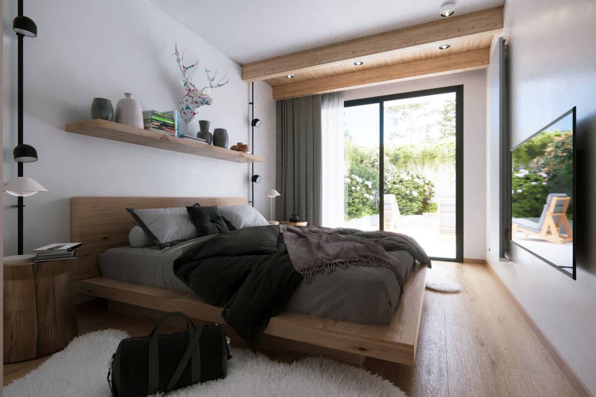 Un dormitorio moderno con una cama de madera, estanterías empotradas y un ventanal grande.