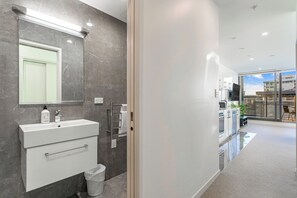 Shower, hair dryer, towels, soap