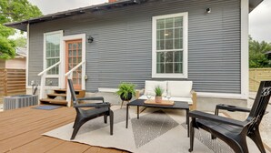 A gray house with a wooden deck, a bench, a table, and a chair. - San Antonio Home 2 Mi to Dtwn, Swim Spa! (San Antonio)