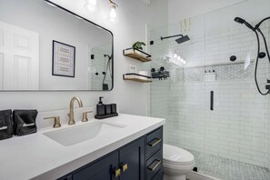 Shower, hair dryer, towels, shampoo