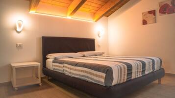 1 bedroom, desk, iron/ironing board, travel crib