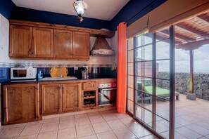 Fridge, microwave, coffee/tea maker, cookware/dishes/utensils