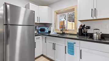 Microwave, stovetop, coffee/tea maker, cookware/dishes/utensils