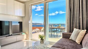 Apartment (One-Bedroom Apartment With Terrace An) | Living room | 32-inch flat-screen TV with satellite channels