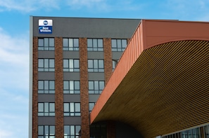 A modern building with a prominent 'Best Western' sign, featuring a brick facade and large windows. - Best Western Hotel Presov (Presov)
