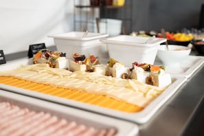 A buffet with various food items and containers. - Best Western Hotel Presov (Presov)