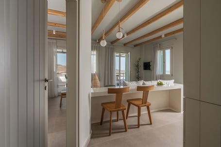 Superior Suite, Jetted Tub, Sea View | Living area | 40-inch Smart TV with digital channels. Castello Amorgos Suites