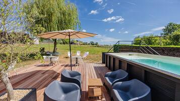Seasonal outdoor pool, open 10:00 AM to 9:00 PM, pool umbrellas