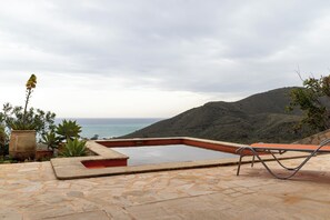 A swimming pool with a view of the ocean and hills. - CT 385 - Faro's Soulrise Villa - Mojacar (Mojacar)