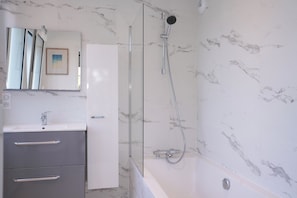 Shower, hair dryer, towels, soap