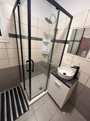 Shower, hair dryer, towels, soap