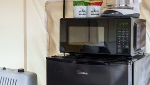 A compact kitchenette with a microwave, coffee maker, and a small refrigerator. - Large tent on massive Big Rock Creek Estate! (Saint Croix Falls)