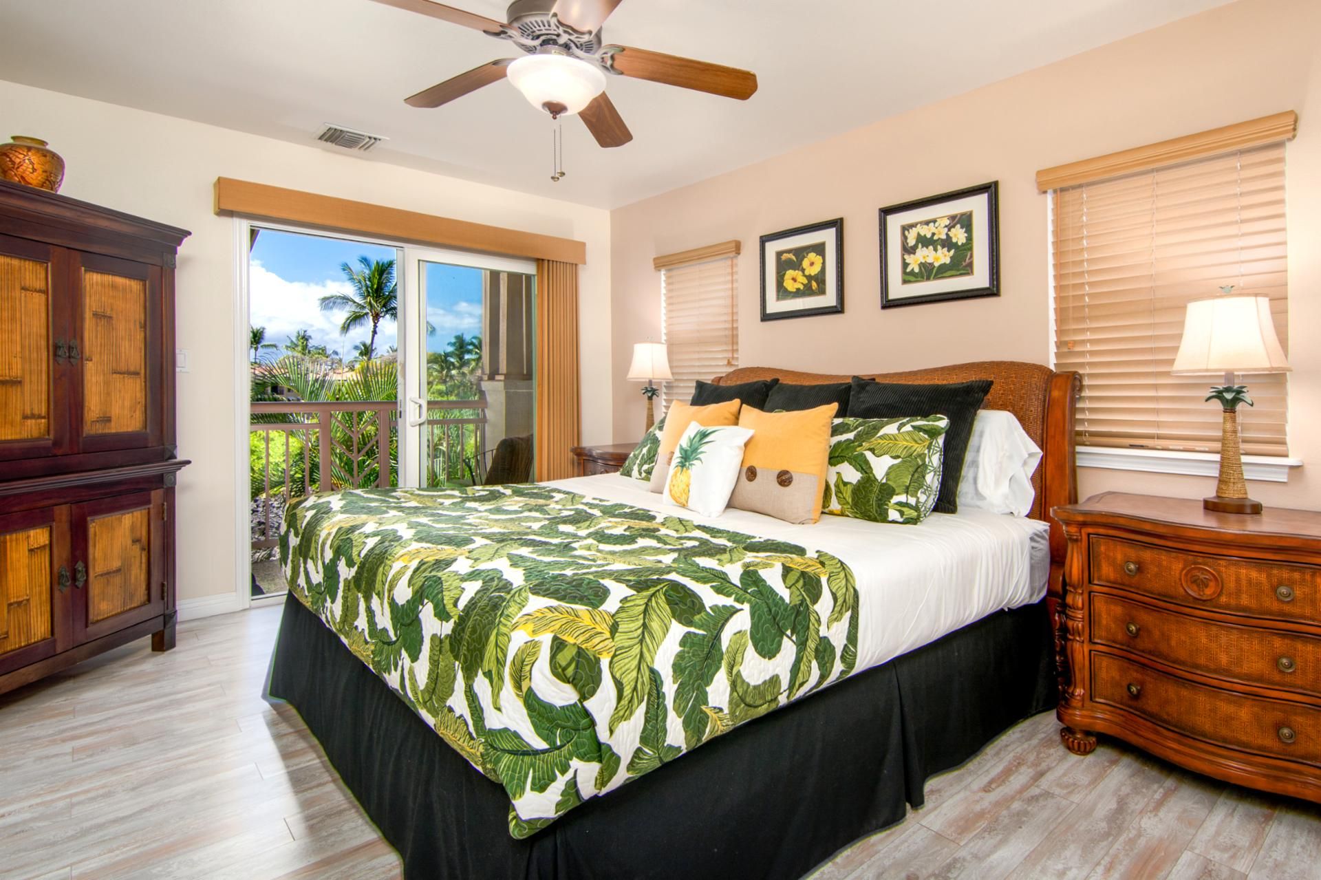 A bedroom with a bed, a nightstand, a wooden cabinet, a ceiling fan, and a window with blinds.