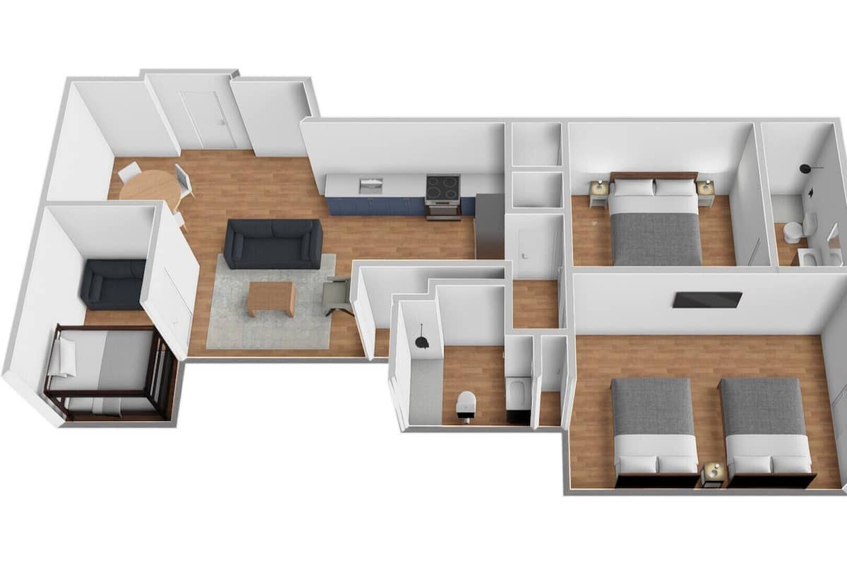 A floor plan of a hotel room with a living area, a separate bedroom, a bathroom, and a kitchenette.
