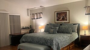 A bedroom with a bed, bedside tables, a desk, and a window with blinds. - Beautiful home, near the Monterey Bay, Carmel & Pebble Beach (Salinas)