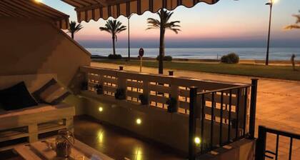 Beautiful apartment with large terrace on the beach in Porto Zaparaya