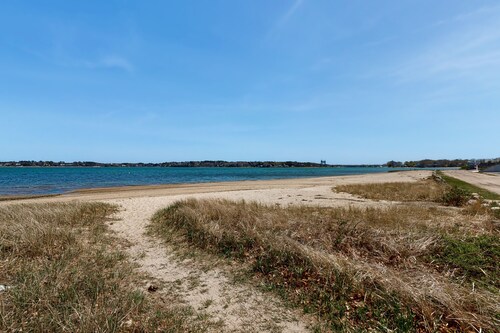 Charming coastal home with sunny rooms, private backyard, & walk to beach