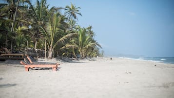 On the beach, sun-loungers, beach towels