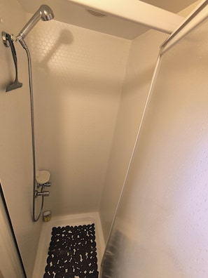 Shower, hair dryer, towels, toilet paper