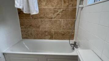 Shower, towels, soap, toilet paper